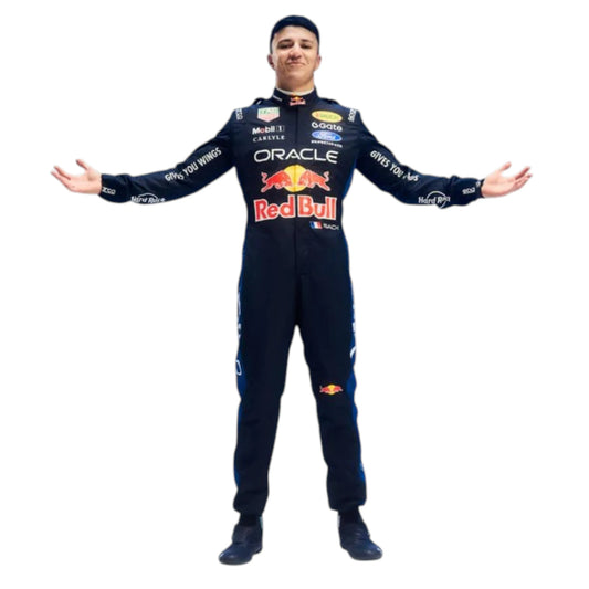 Isack Hadjar 2026 Red Bull F1 race suit in dark navy blue with red and yellow accents featuring sponsor logos