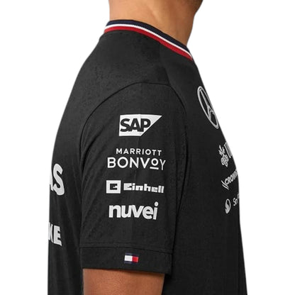 2024 Mercedes-AMG Petronas F1 Pilot T-Shirt in black featuring Mercedes-AMG, Petronas and team sponsor logos with a red and black striped crew neck
