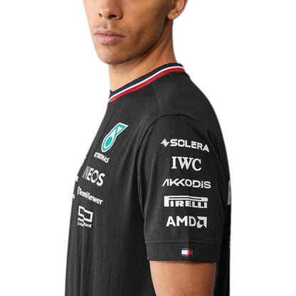 2024 Mercedes-AMG Petronas F1 Pilot T-Shirt in black featuring Mercedes-AMG, Petronas and team sponsor logos with a red and black striped crew neck