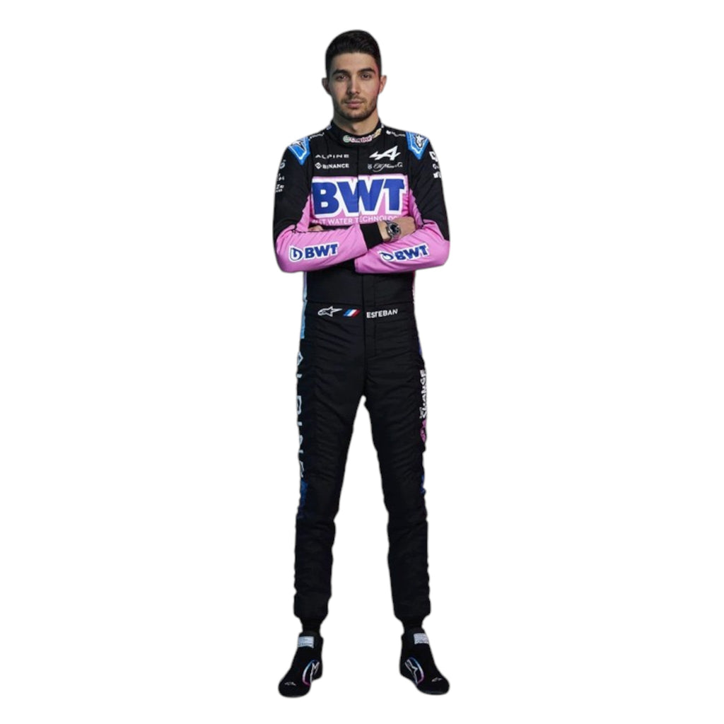 Esteban Ocon 2024 Alpine F1 race suit in black, blue, and pink with sponsor branding