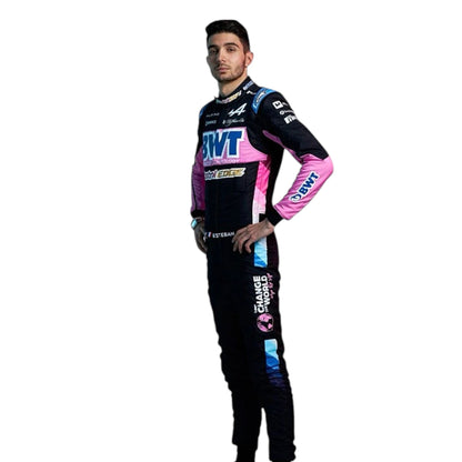 Esteban Ocon 2024 Alpine F1 race suit in black, blue, and pink with sponsor branding