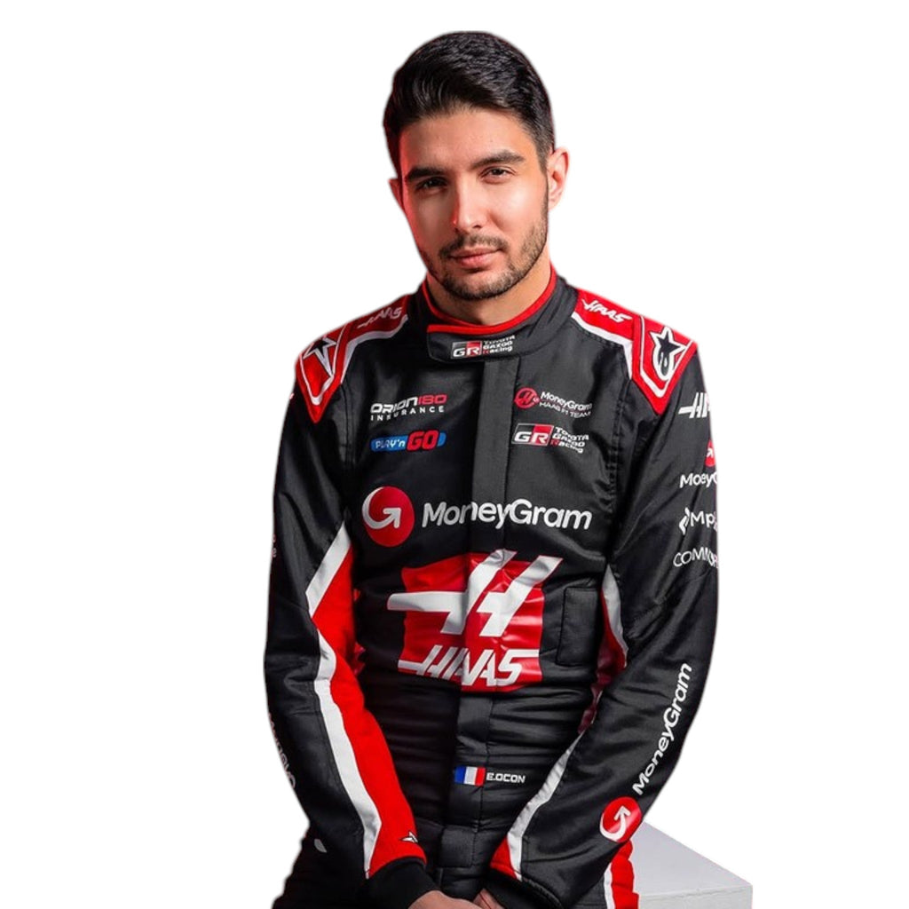Esteban Ocon 2025 Haas F1 race suit in black, white, and red with sponsor branding and VF 25 team branding