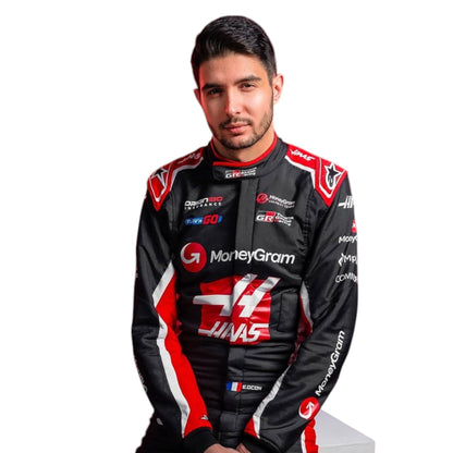 Esteban Ocon 2025 Haas F1 race suit in black, white, and red with sponsor branding and VF 25 team branding