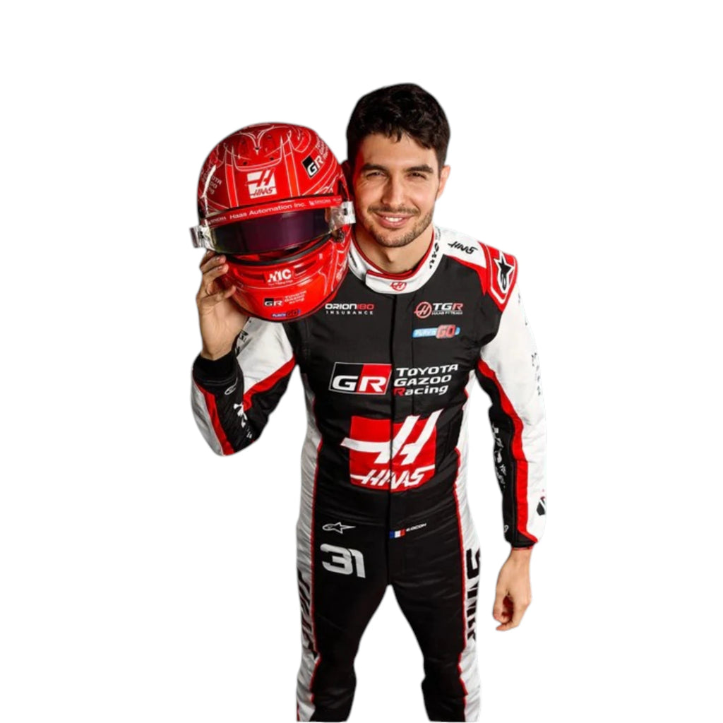 Esteban Ocon 2026 Haas F1 race suit in black, white, and red with sponsor logos