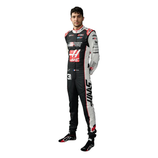 Esteban Ocon 2026 Haas F1 race suit in black, white, and red with sponsor logos
