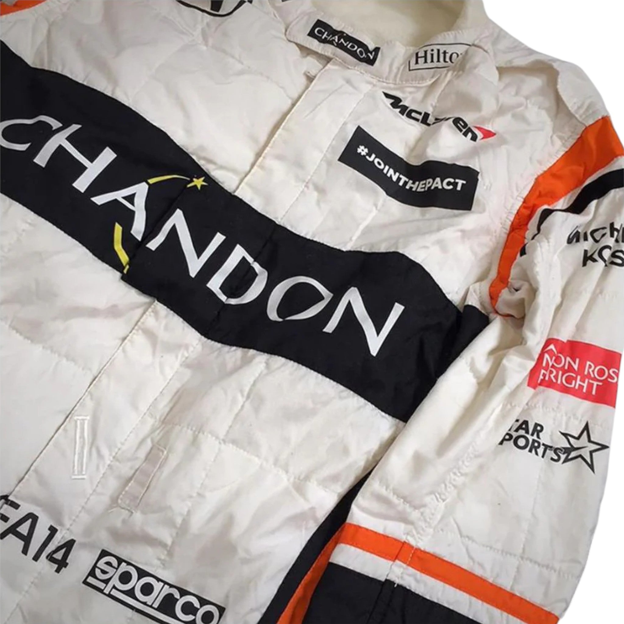 Fernando Alonso 2017 McLaren F1 race suit in white with black and orange accents design featuring Chandon sponsor