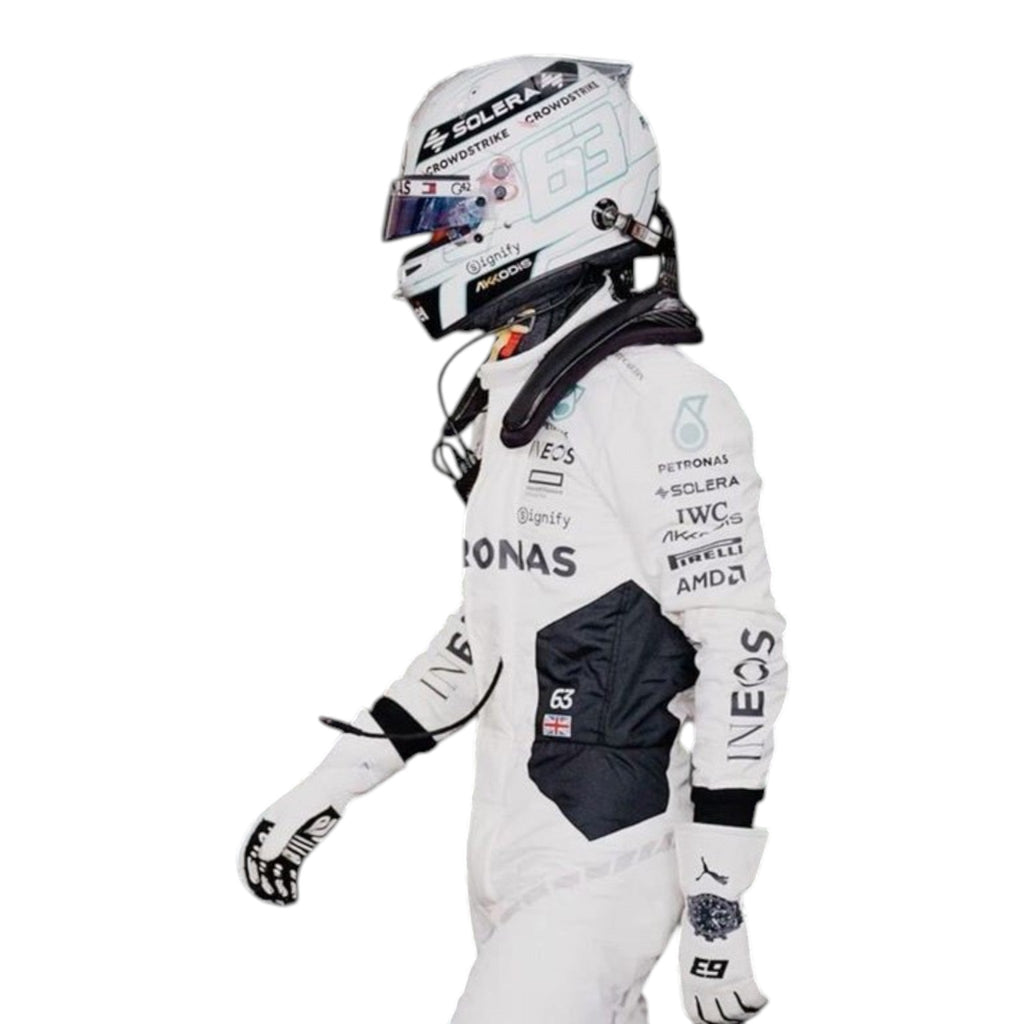 George Russell wearing a 2024 Mercedes-AMG Petronas Qatar GP F1 race suit in white with black accents and sponsor logos