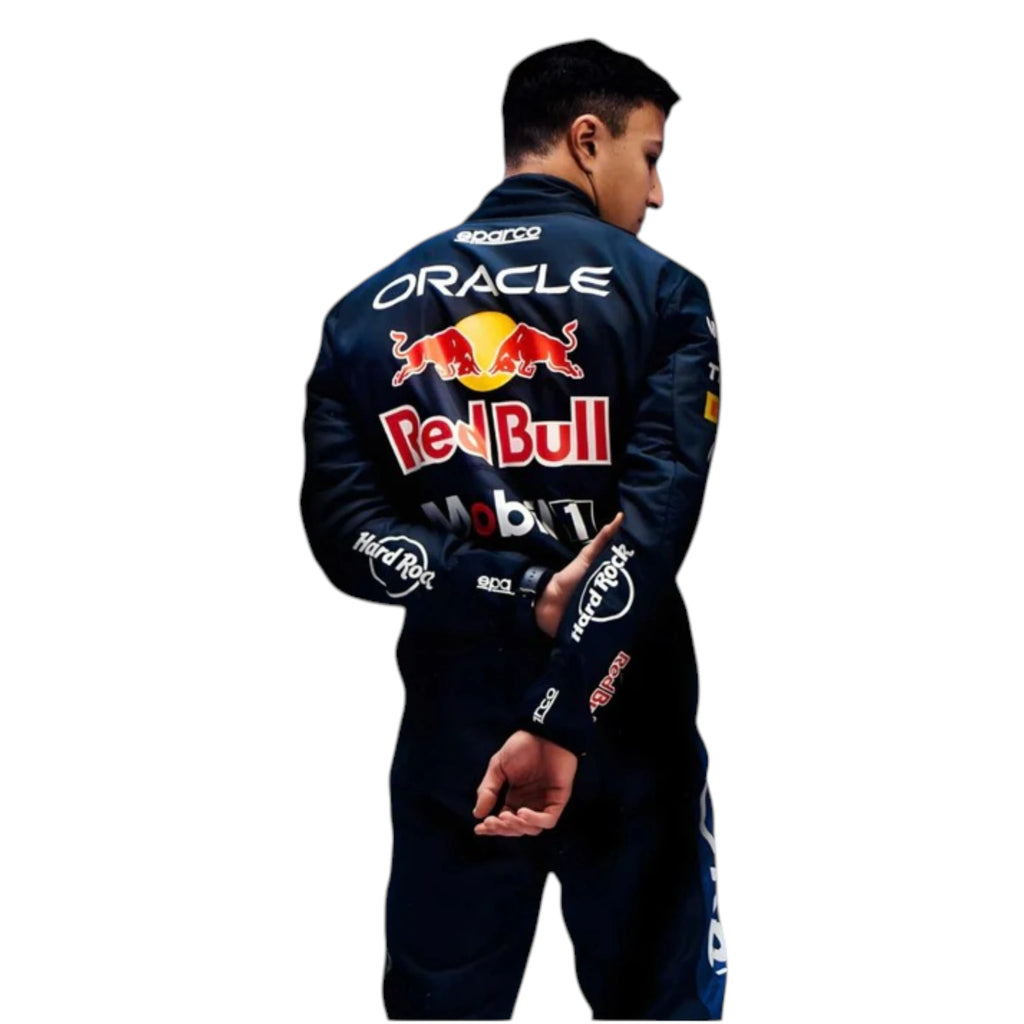 Isack Hadjar 2026 Red Bull F1 race suit in dark navy blue with red and yellow accents featuring sponsor logos
