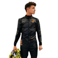 Lando Norris 2025 McLaren F1 Team black suit with papaya accents and sponsor logos