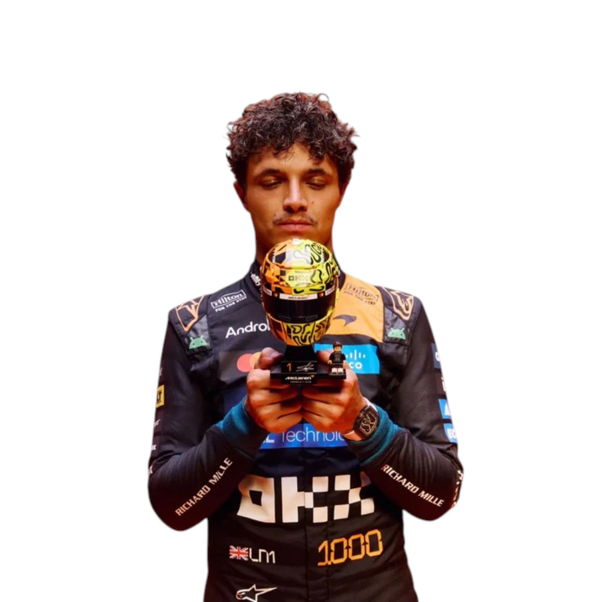 Lando Norris 2026 McLaren 1000th Monaco GP F1 race suit featuring a black, papaya orange and blue colourway with special edition McLaren detailing