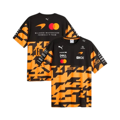 McLaren F1 Team 1000th Grand Prix Replica T-Shirt in black and orange featuring McLaren F1 Team branding and sponsor logos
