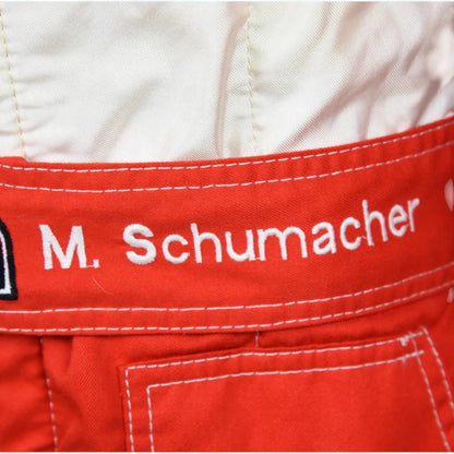 Michael Schumacher 1997 Ferrari F1 Racing Suit featuring iconic red Ferrari racing graphics and authentic sponsor detailing
