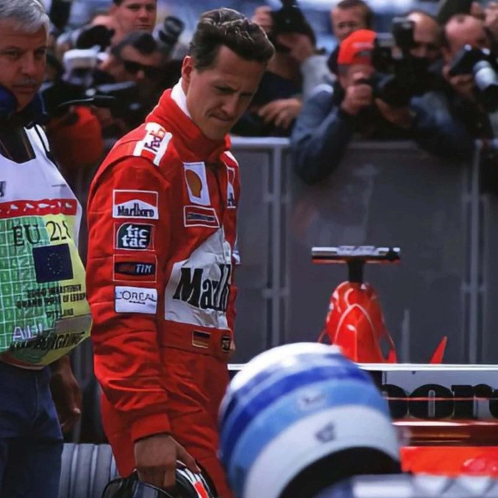 Michael Schumacher 2002 Ferrari F1 Racing Suit in red featuring iconic Ferrari racing graphics and authentic sponsor detailing