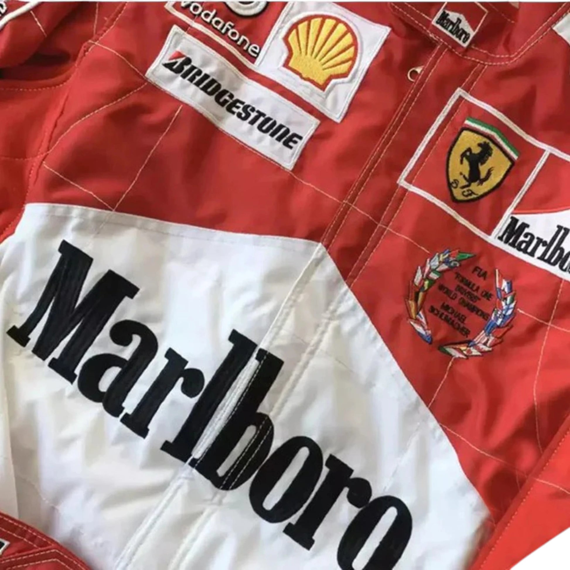 Michael Schumacher 2005 Ferrari F1 Racing Suit in red featuring iconic Ferrari racing graphics, authentic sponsor detailing, and championship inspired design
