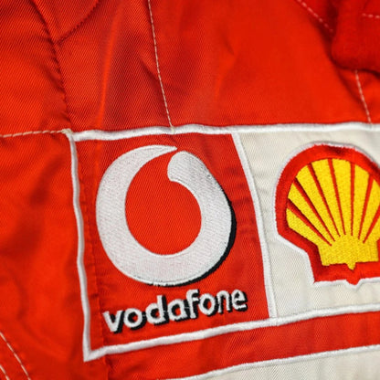 Michael Schumacher 2006 Ferrari F1 Racing Suit in red and white featuring iconic Ferrari racing graphics, authentic sponsor detailing, and championship inspired design