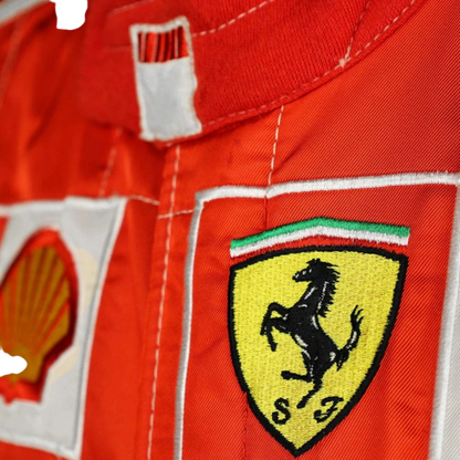 Michael Schumacher 2006 Ferrari F1 Racing Suit in red and white featuring iconic Ferrari racing graphics, authentic sponsor detailing, and championship inspired design