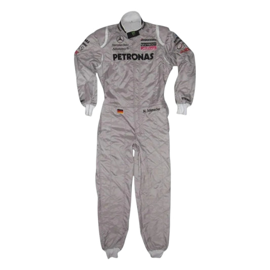 Michael Schumacher 2010 Mercedes AMG Petronas F1 Racing Suit in silver featuring iconic Mercedes-AMG Petronas team graphics, authentic sponsor detailing, and championship inspired design