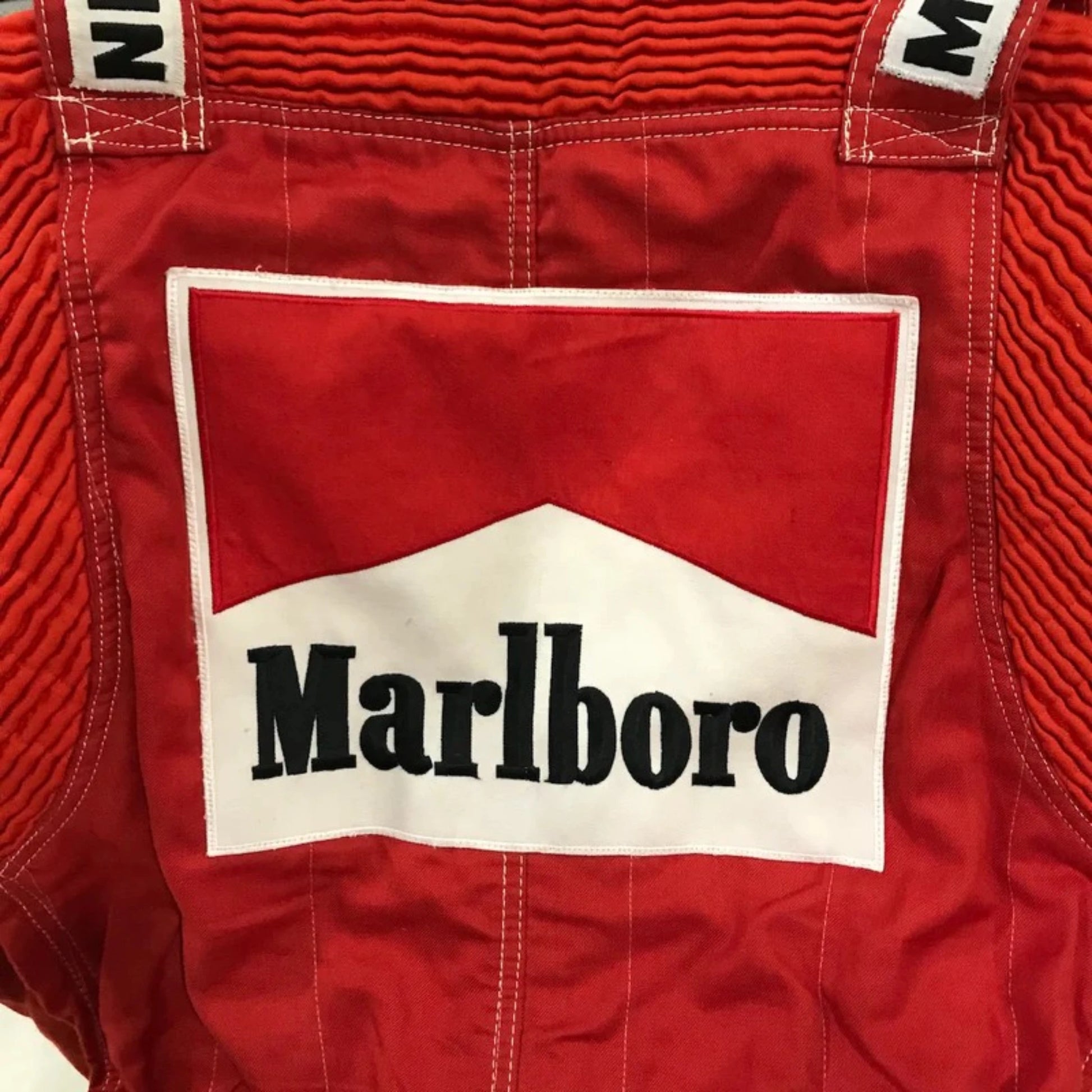 Niki Lauda 1984 McLaren F1 Racing Suit in red with authentic vintage Marlboro and Boss sponsor detailing