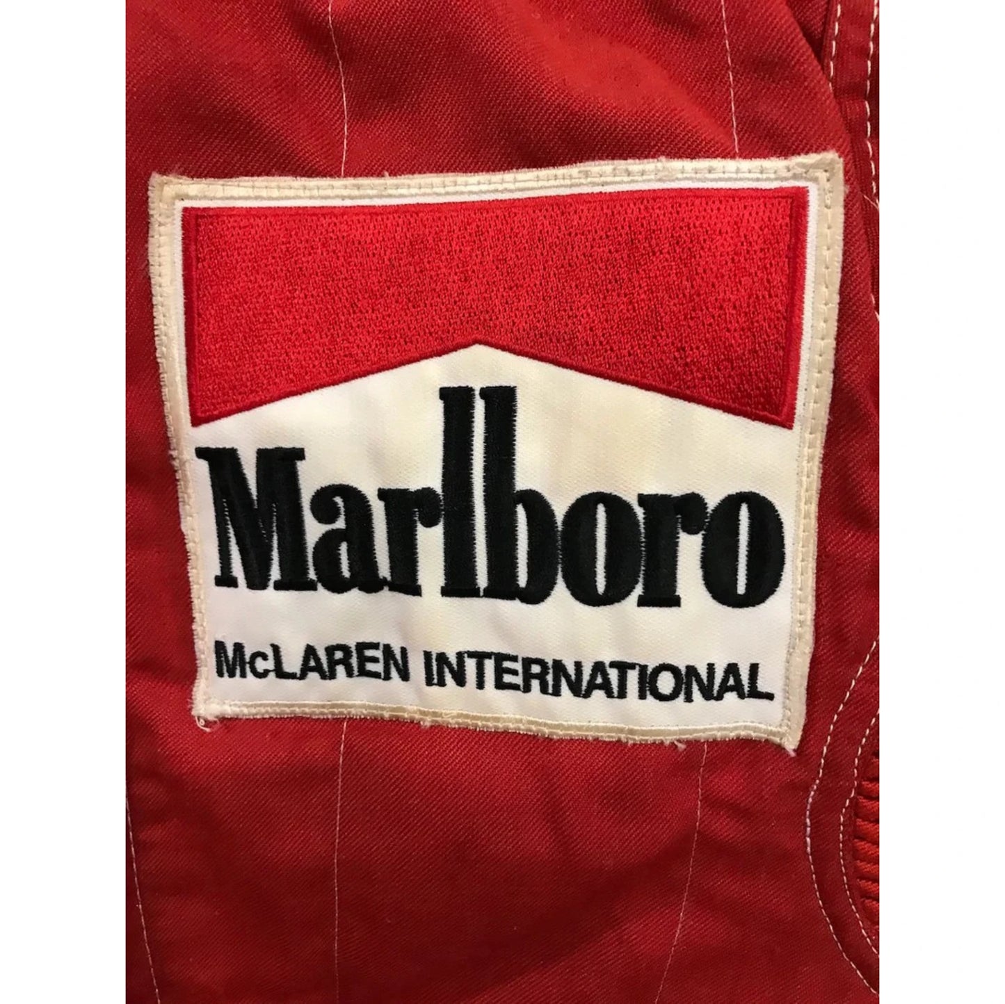 Niki Lauda 1984 McLaren F1 Racing Suit in red with authentic vintage Marlboro and Boss sponsor detailing