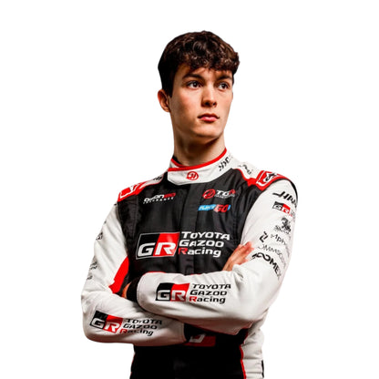 Oliver Bearman 2026 Haas F1 race suit in black, white, and red with sponsor logos