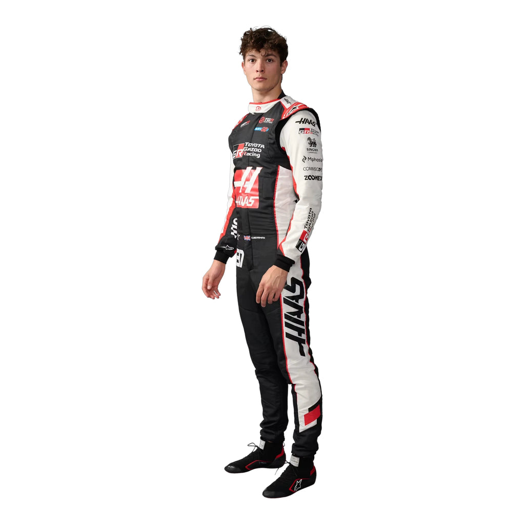 Oliver Bearman 2026 Haas F1 race suit in black, white, and red with sponsor logos