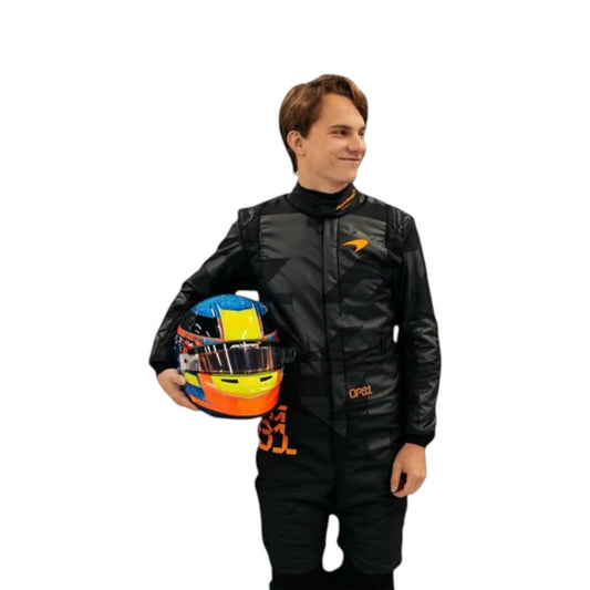 Oscar Piastri 2025 McLaren F1 Team black suit with papaya accents and sponsor logos