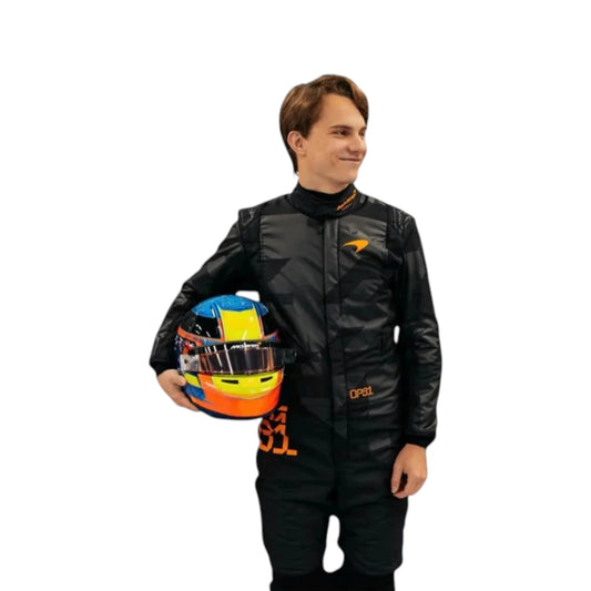 Oscar Piastri 2025 McLaren F1 Team black suit with papaya accents and sponsor logos