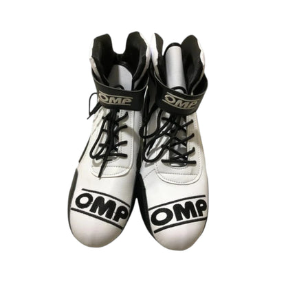 Sonny Hayes APXGP OMP F1 racing shoes featuring white and black APXGP OMP styling with motorsport detailing